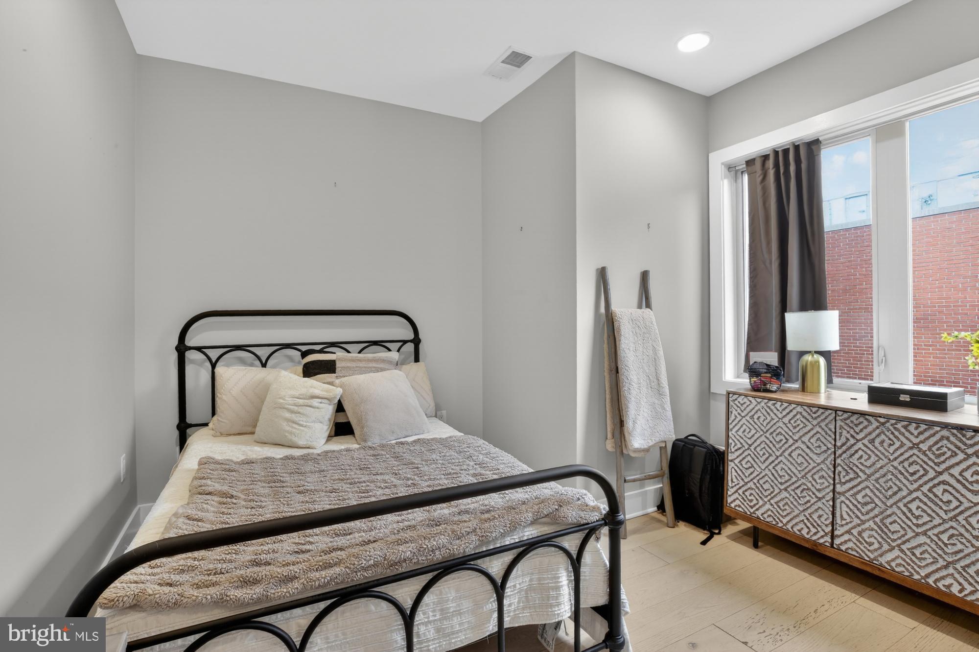 151 North 2nd Street, Unit 5 Philadelphia, PA 19106 - Photo 12 of 35 a bedroom with a bed and a window