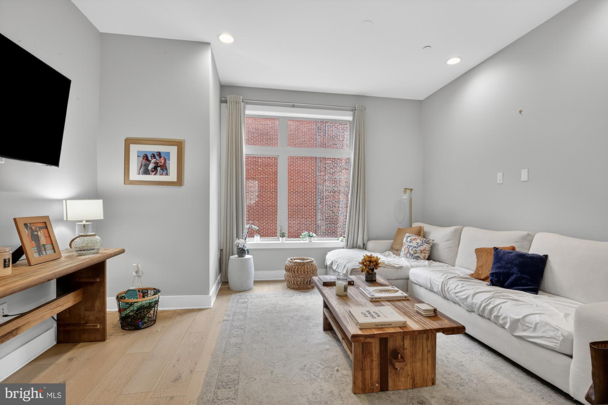 151 North 2nd Street, Unit 5 Philadelphia, PA 19106 - Photo 2 of 35 a living room with furniture and a flat screen tv