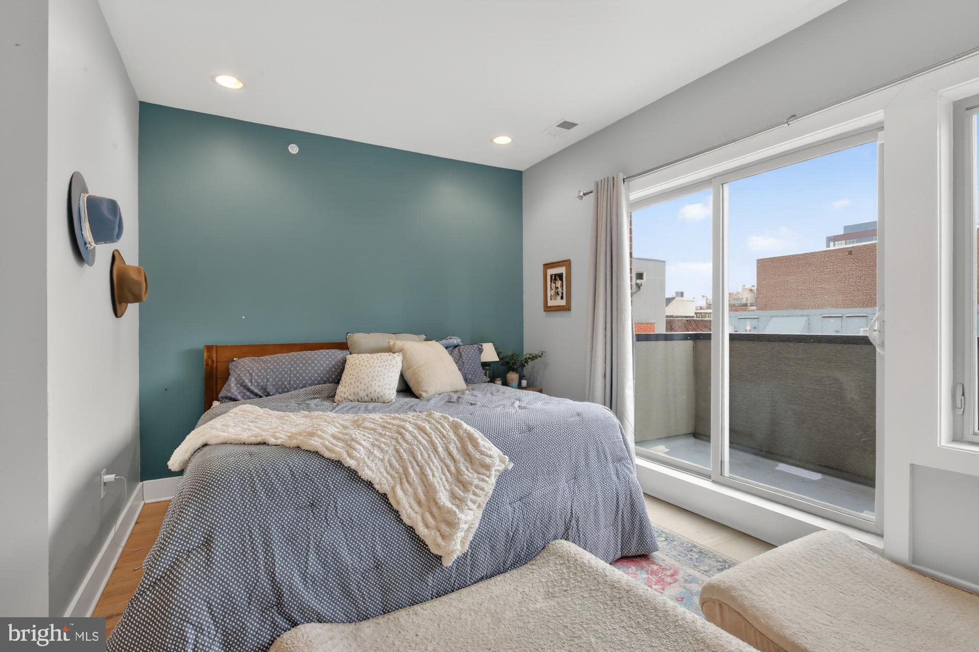 151 North 2nd Street, Unit 5 Philadelphia, PA 19106 - Photo 21 of 35 a bedroom with a bed and a mirror