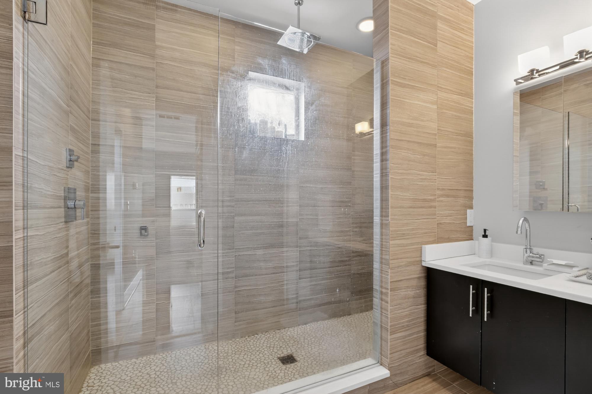 151 North 2nd Street, Unit 5 Philadelphia, PA 19106 - Photo 25 of 35 a bathroom with a shower and a sink