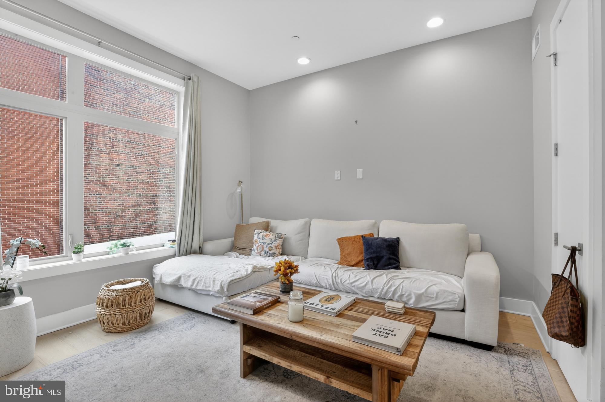 151 North 2nd Street, Unit 5 Philadelphia, PA 19106 - Photo 3 of 35 a living room with furniture and a window