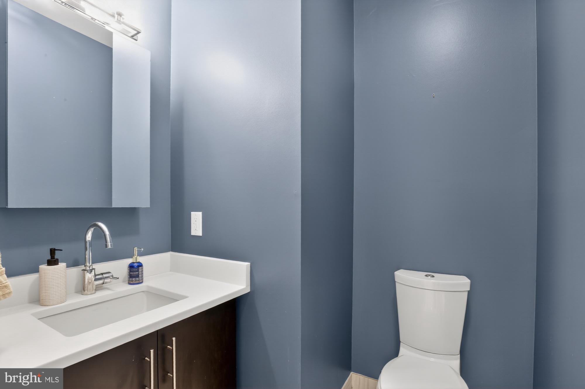 151 North 2nd Street, Unit 5 Philadelphia, PA 19106 - Photo 32 of 35 a bathroom with a toilet sink and mirror