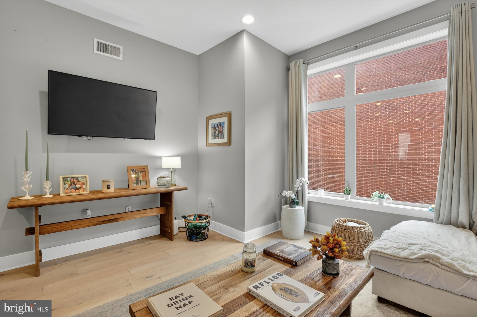 151 North 2nd Street, Unit 5 Philadelphia, PA 19106 - Photo 4 of 35 a living room with furniture and a flat screen tv
