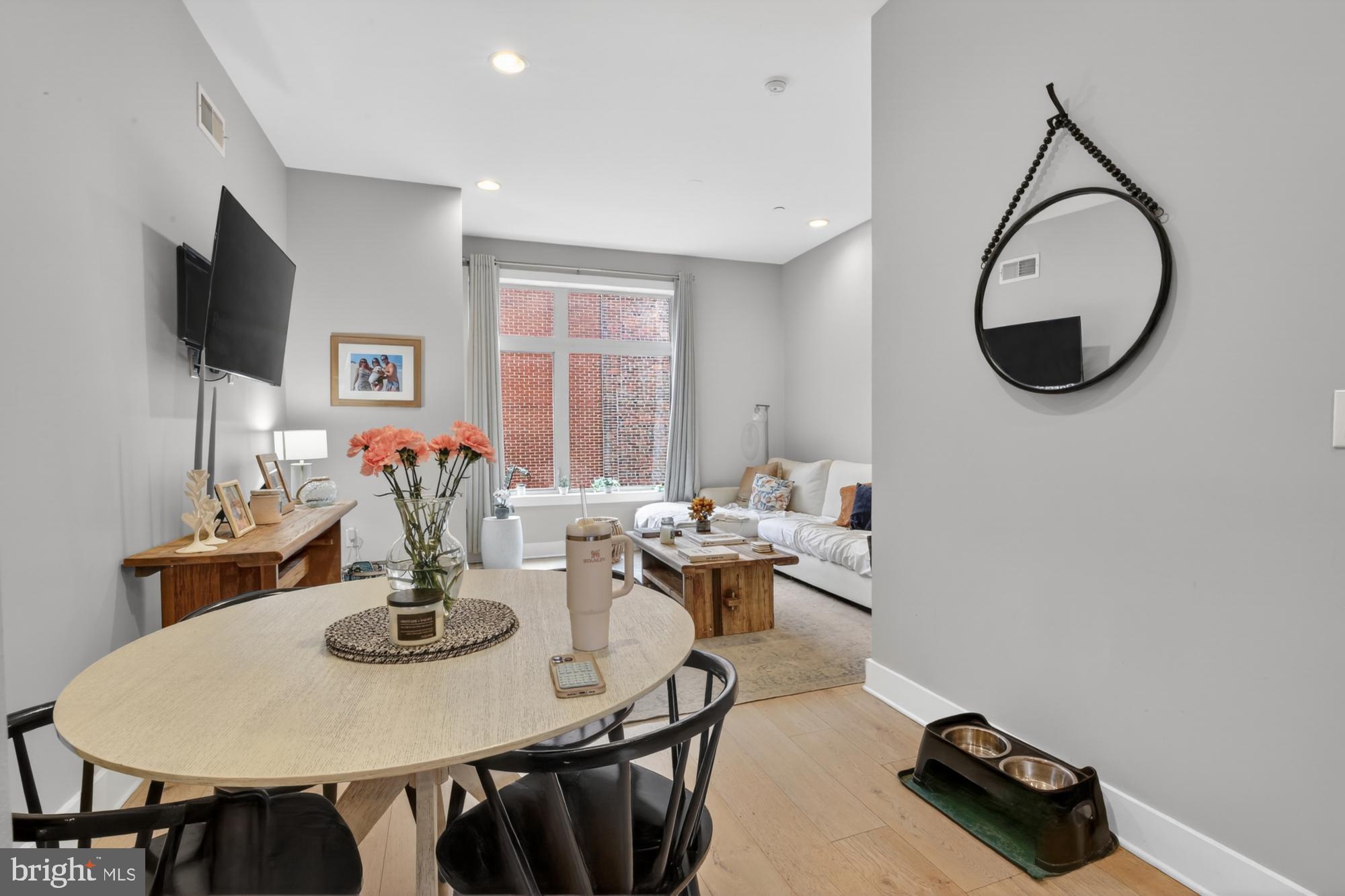 151 North 2nd Street, Unit 5 Philadelphia, PA 19106 - Photo 9 of 35 a view of a dining room with furniture and a flat screen tv