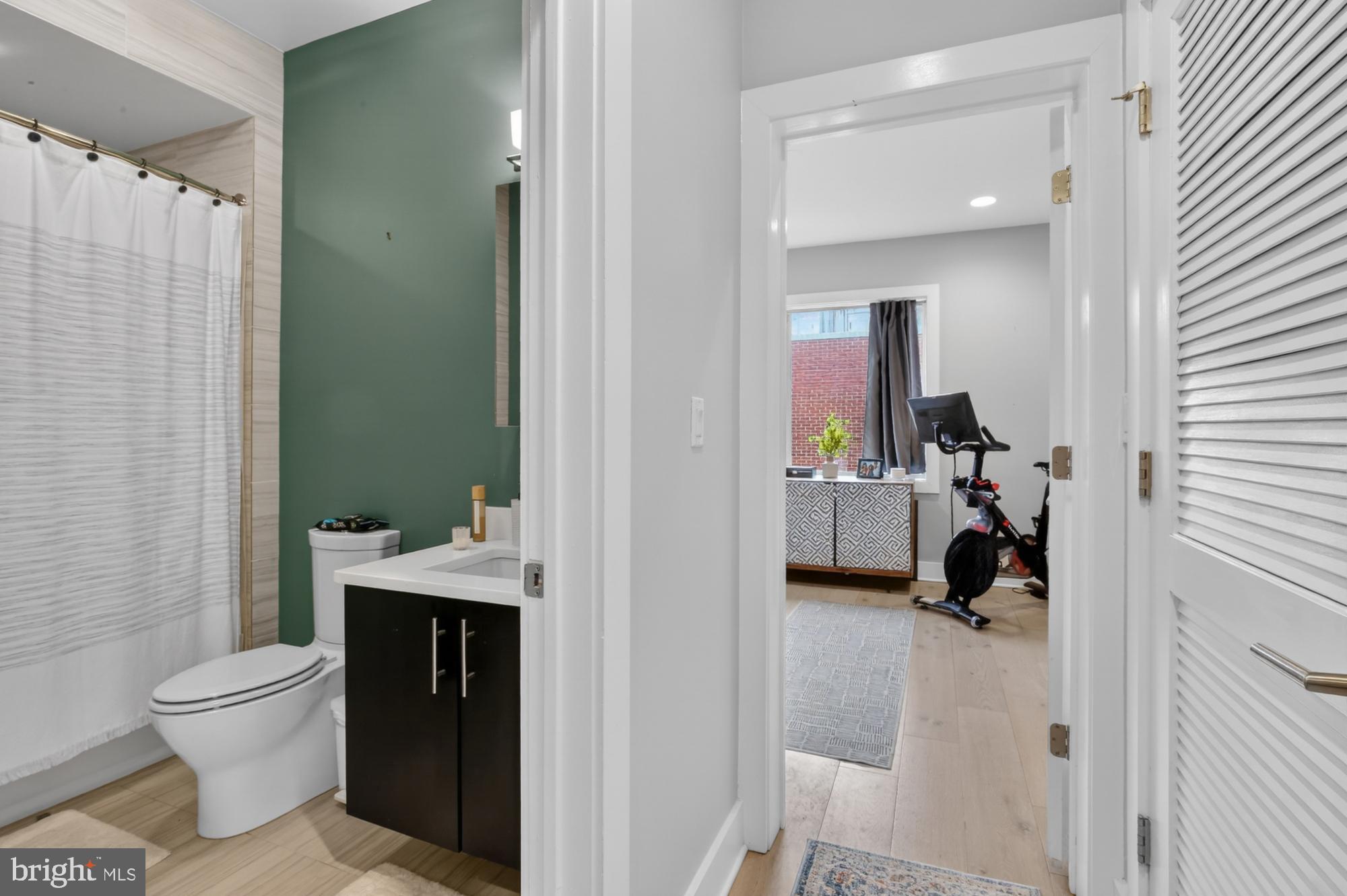 151 North 2nd Street, Unit 5 Philadelphia, PA 19106 - Photo 10 of 35 a en suite bathroom with a granite countertop sink and a mirror
