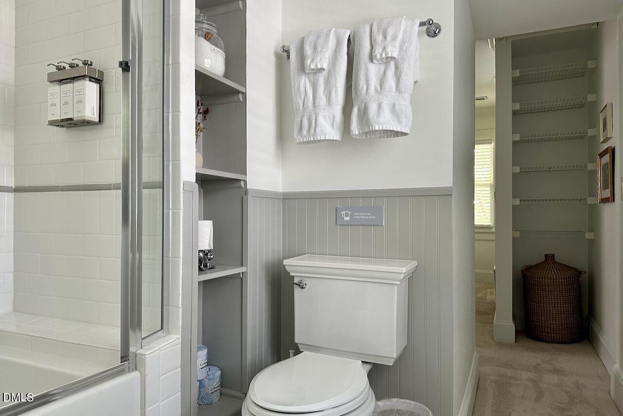 116 Hillcrest Road Raleigh, NC 27605 - Photo 20 of 34 a white toilet sitting next to a bathroom sink