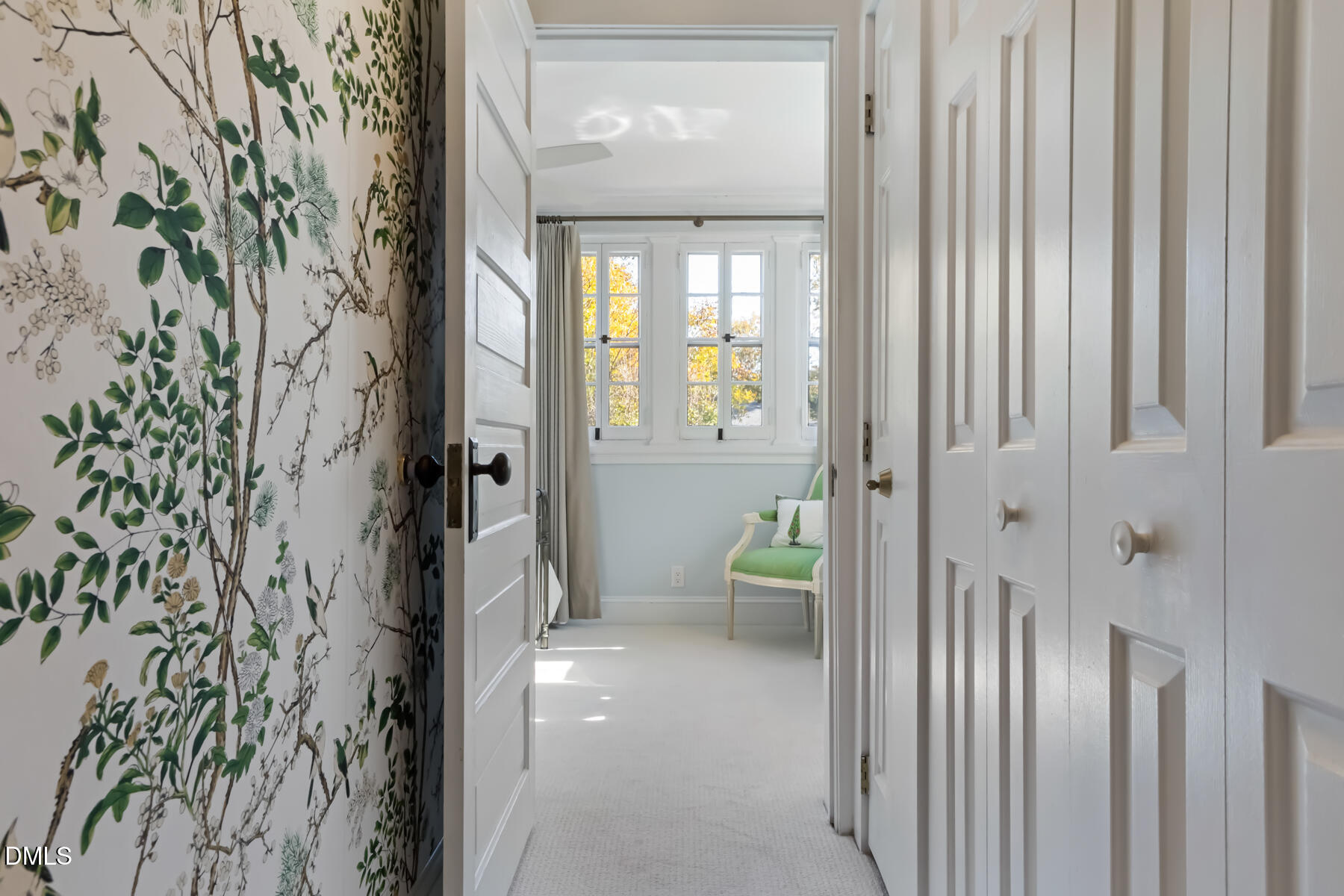 116 Hillcrest Road Raleigh, NC 27605 - Photo 21 of 34 a view of a hallway with a livingroom and a chair