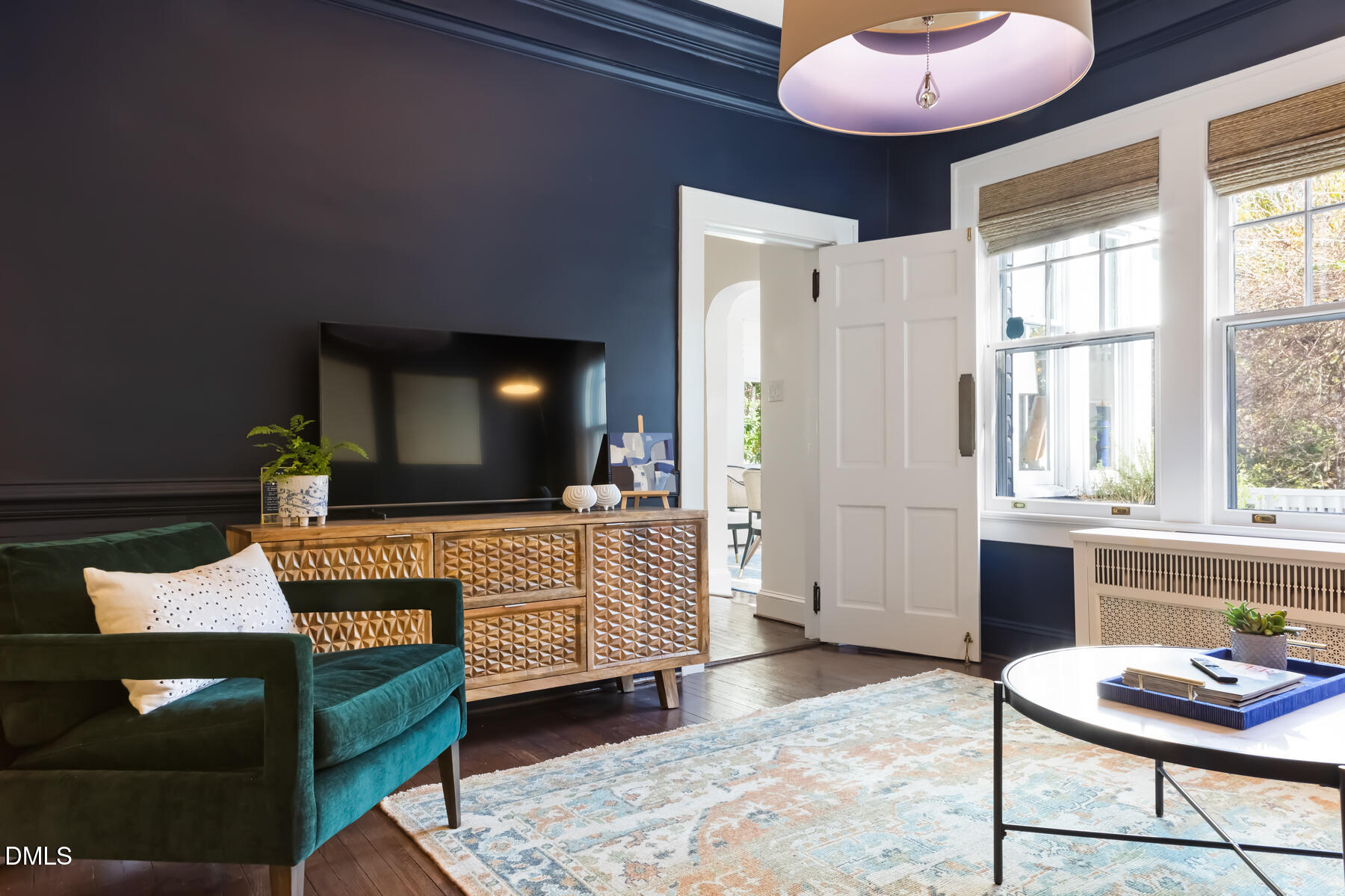 116 Hillcrest Road Raleigh, NC 27605 - Photo 6 of 34 a living room with furniture and a flat screen tv