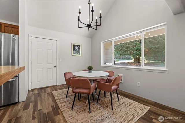 a view of a dining room with furniture window and wooden floor