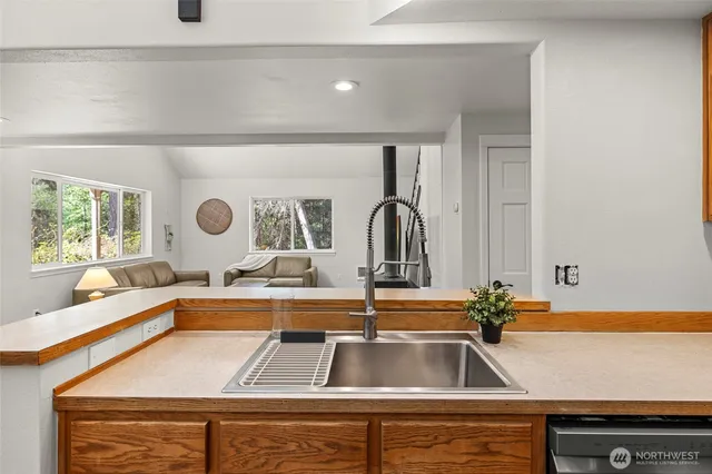 a kitchen with a sink and a window