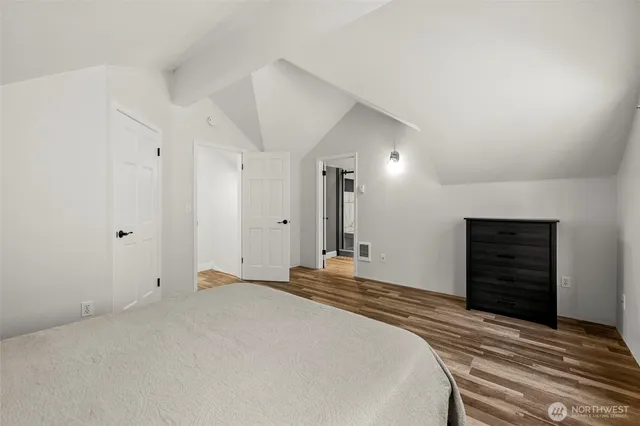 a bedroom with a bed and a dresser