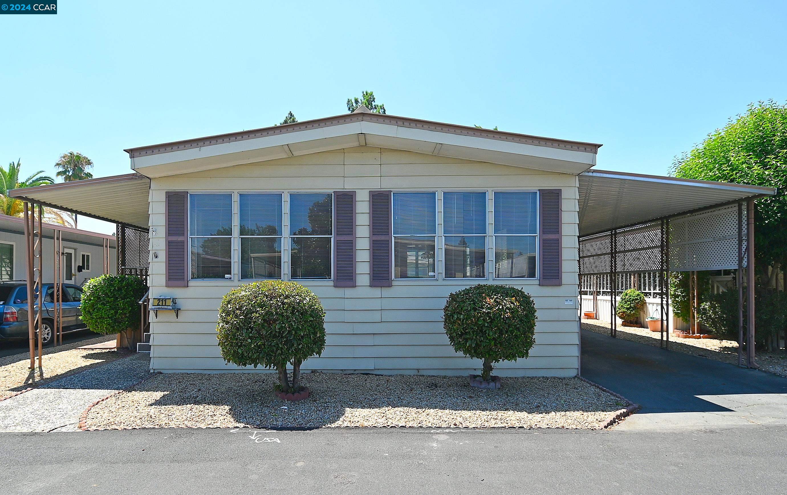 211 Kona Circle Pittsburg, CA 94565 - Photo 1 of 1 a front view of a house