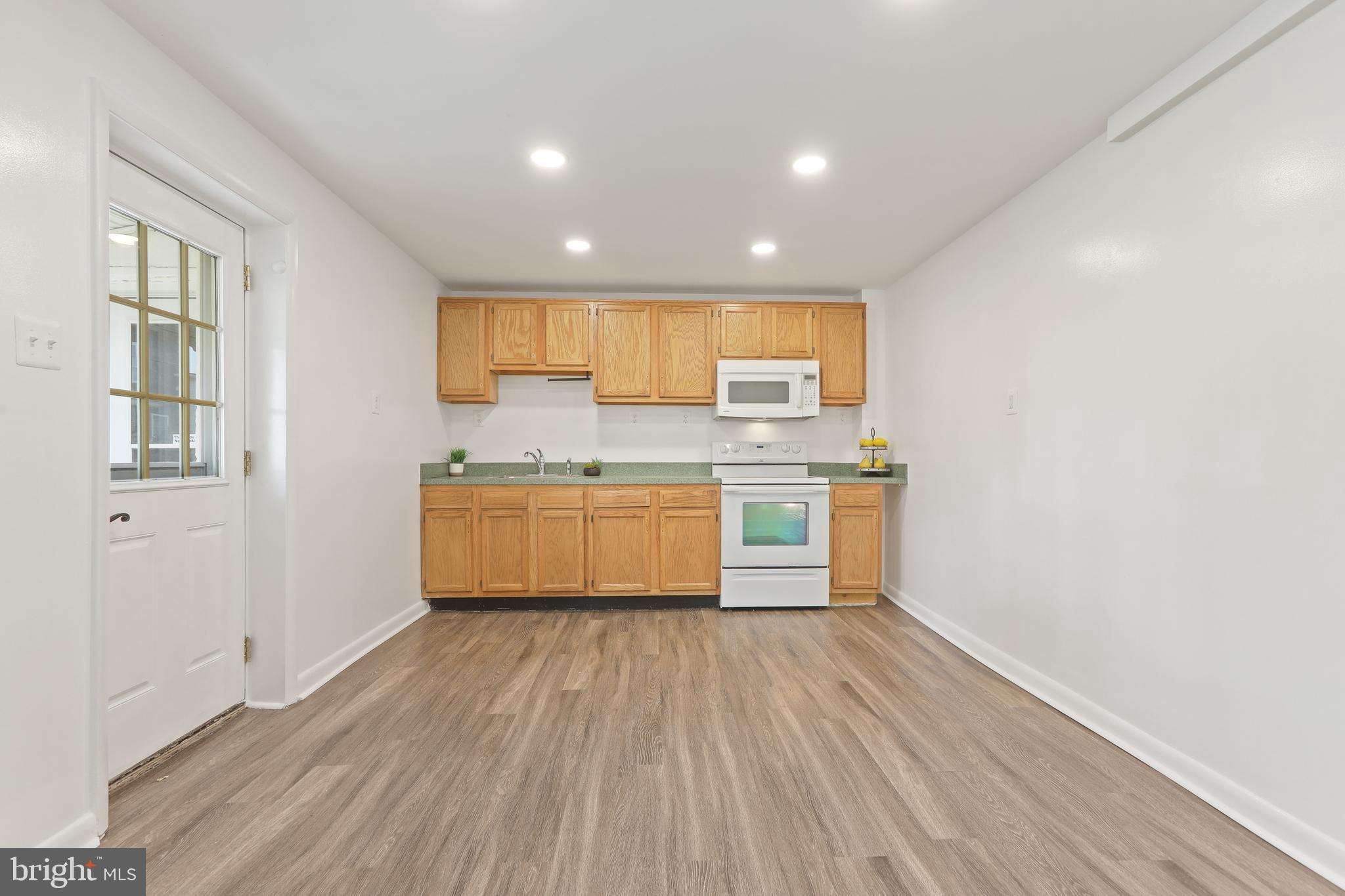 7823 Denton Avenue, Unit 5 Sparrows Point, MD 21219 - Photo 13 of 43 Eat-In Kitchen 14' x 10' w/New Luxury Vinyl Plank