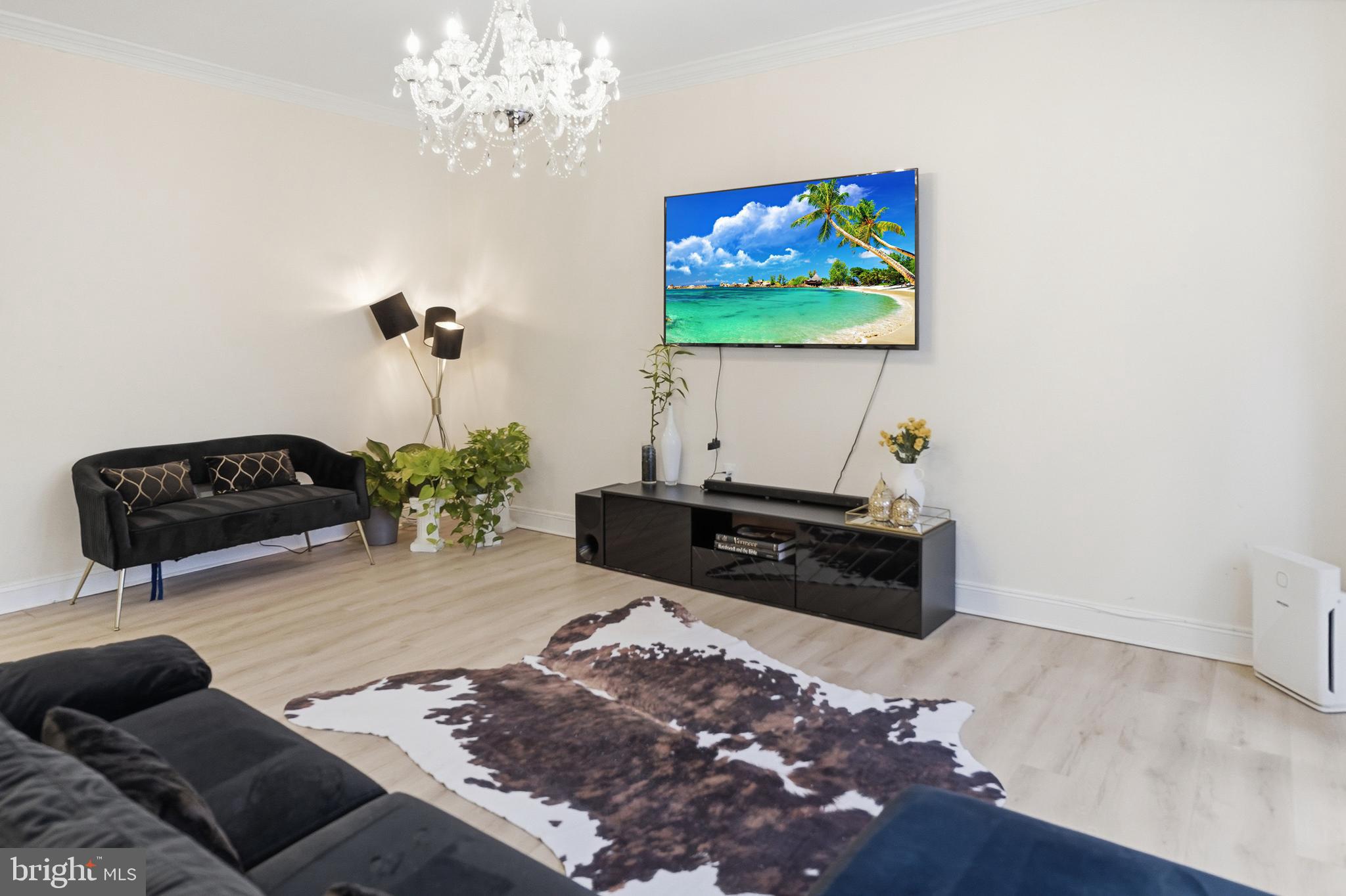 6524 Milva Lane Springfield, VA 22150 - Photo 11 of 47 a living room with furniture and a flat screen tv