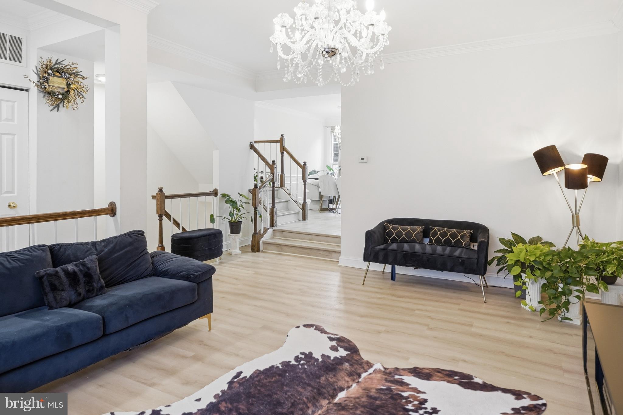 6524 Milva Lane Springfield, VA 22150 - Photo 12 of 47 a living room with furniture and a chandelier