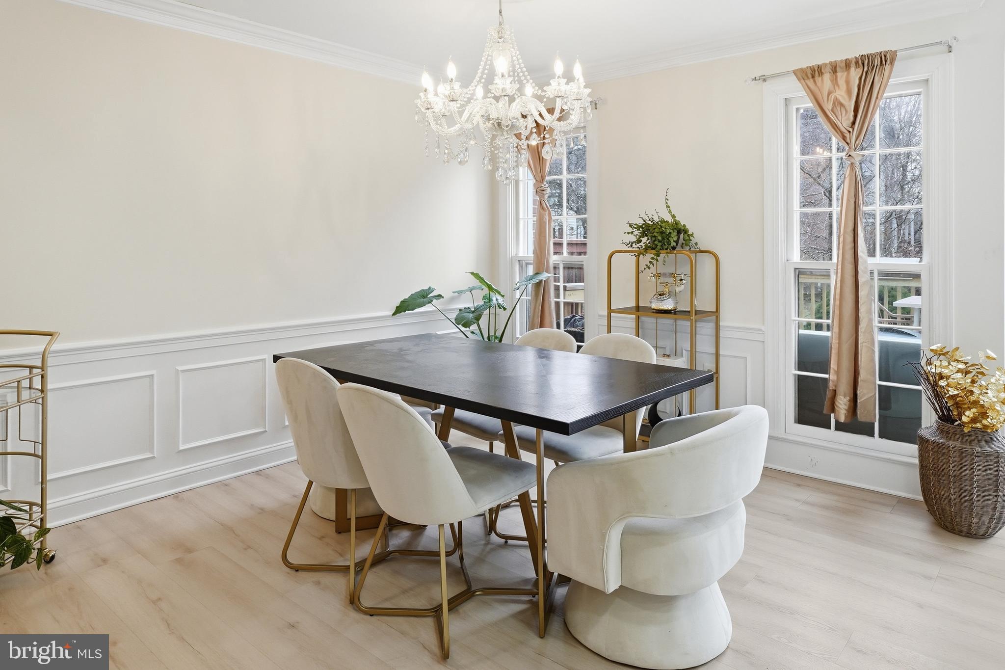 6524 Milva Lane Springfield, VA 22150 - Photo 18 of 47 a view of a dining room with furniture and chandelier