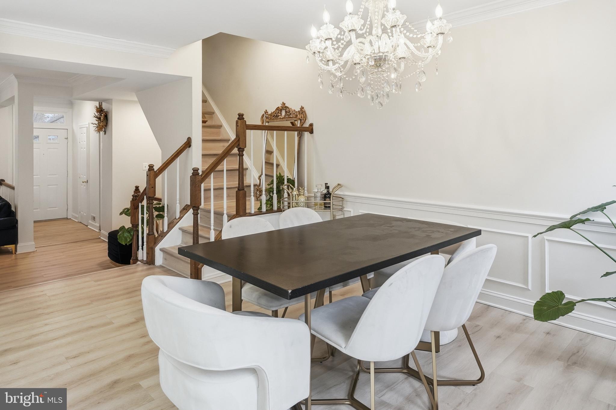 6524 Milva Lane Springfield, VA 22150 - Photo 19 of 47 a living room with table chairs and wooden floor