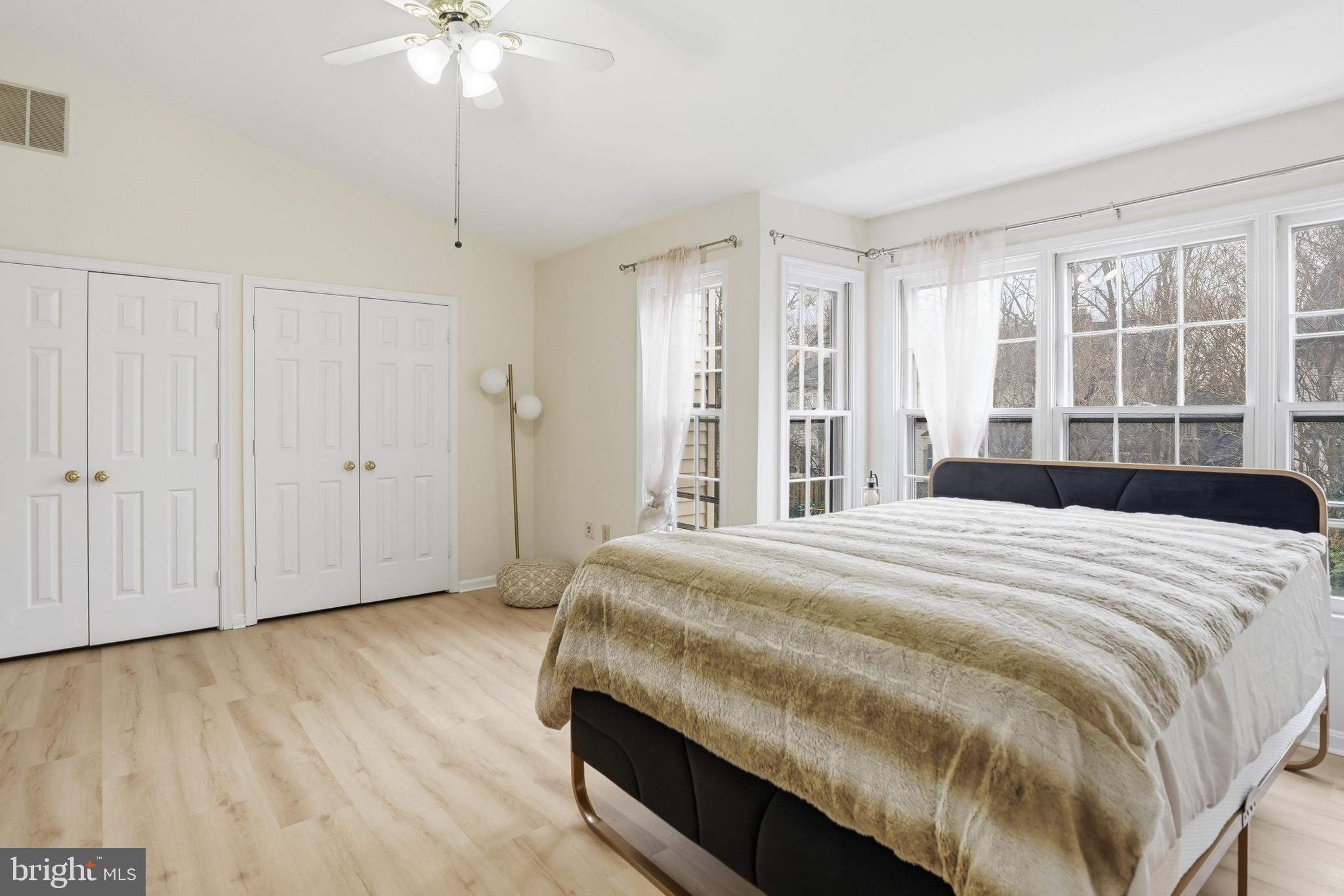 6524 Milva Lane Springfield, VA 22150 - Photo 23 of 47 a bedroom with a bed and a chandelier