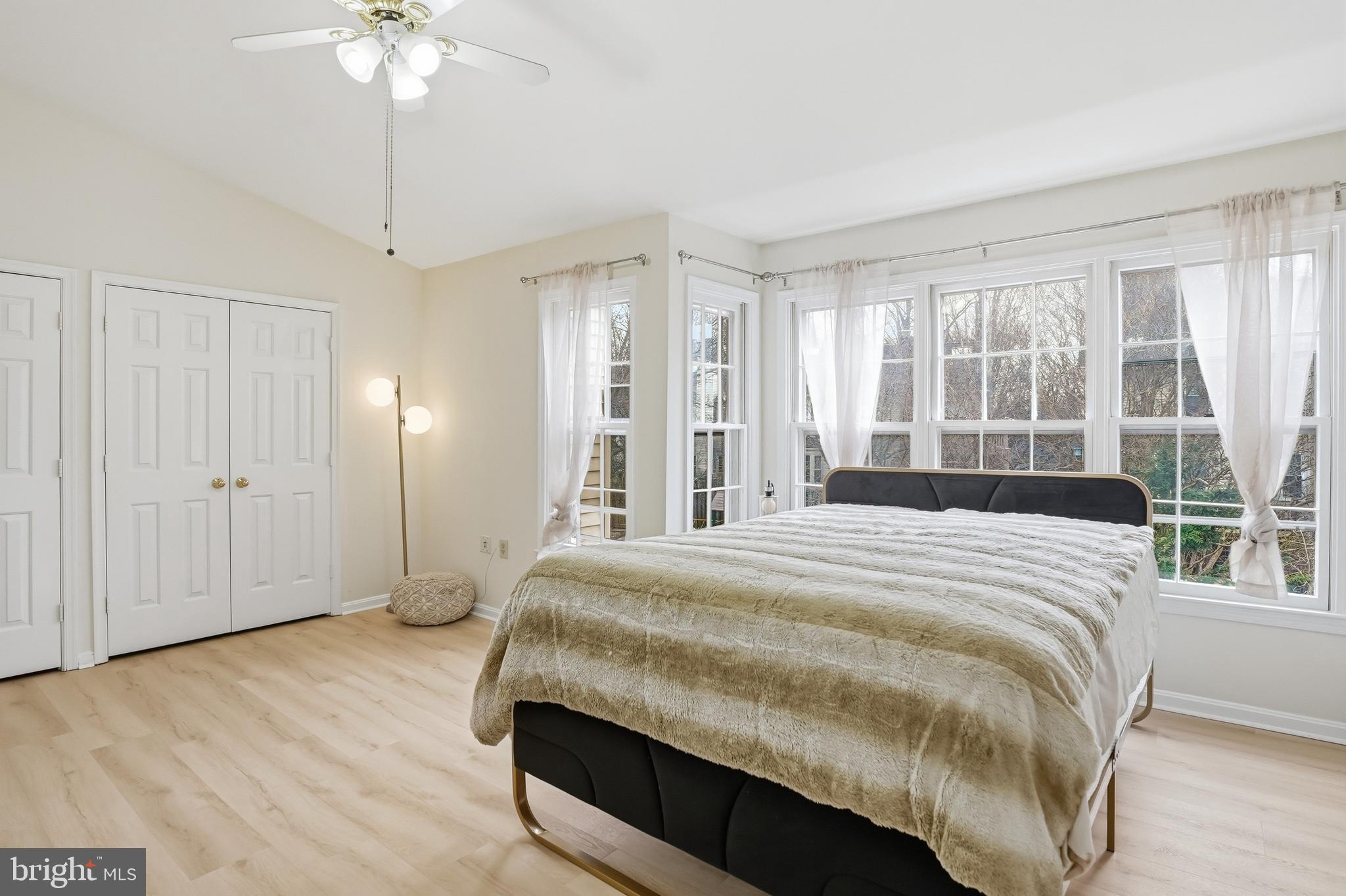 6524 Milva Lane Springfield, VA 22150 - Photo 24 of 47 a bedroom with a bed and a chandelier