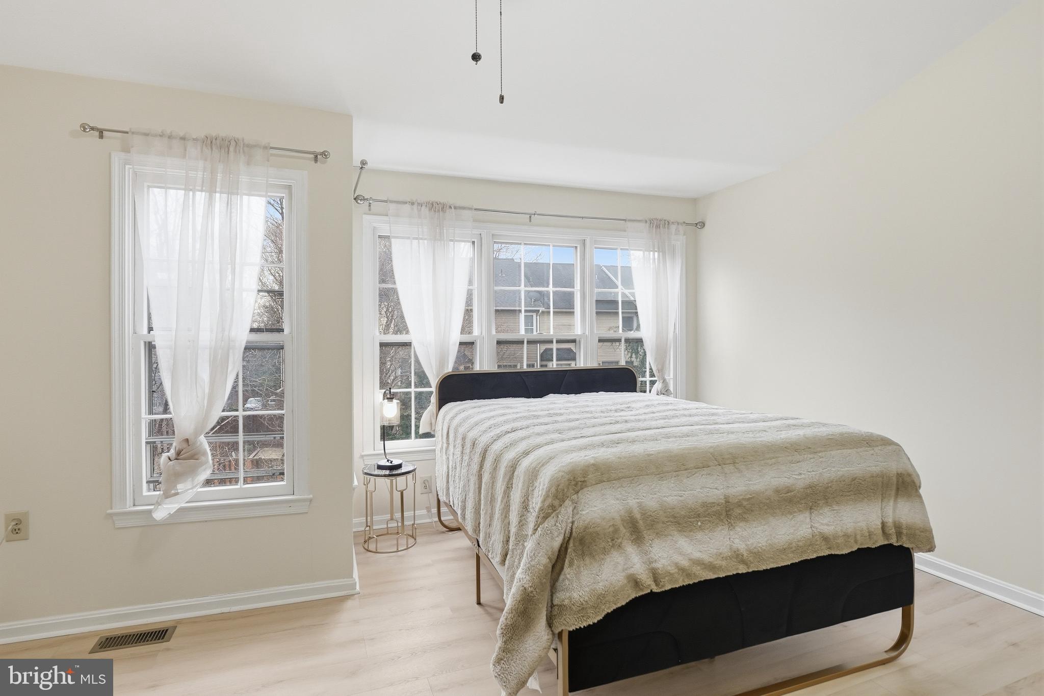 6524 Milva Lane Springfield, VA 22150 - Photo 25 of 47 a bedroom with a bed and a window