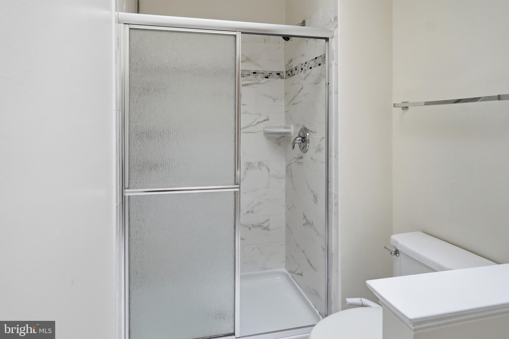 6524 Milva Lane Springfield, VA 22150 - Photo 28 of 47 a bathroom with a shower and toilet