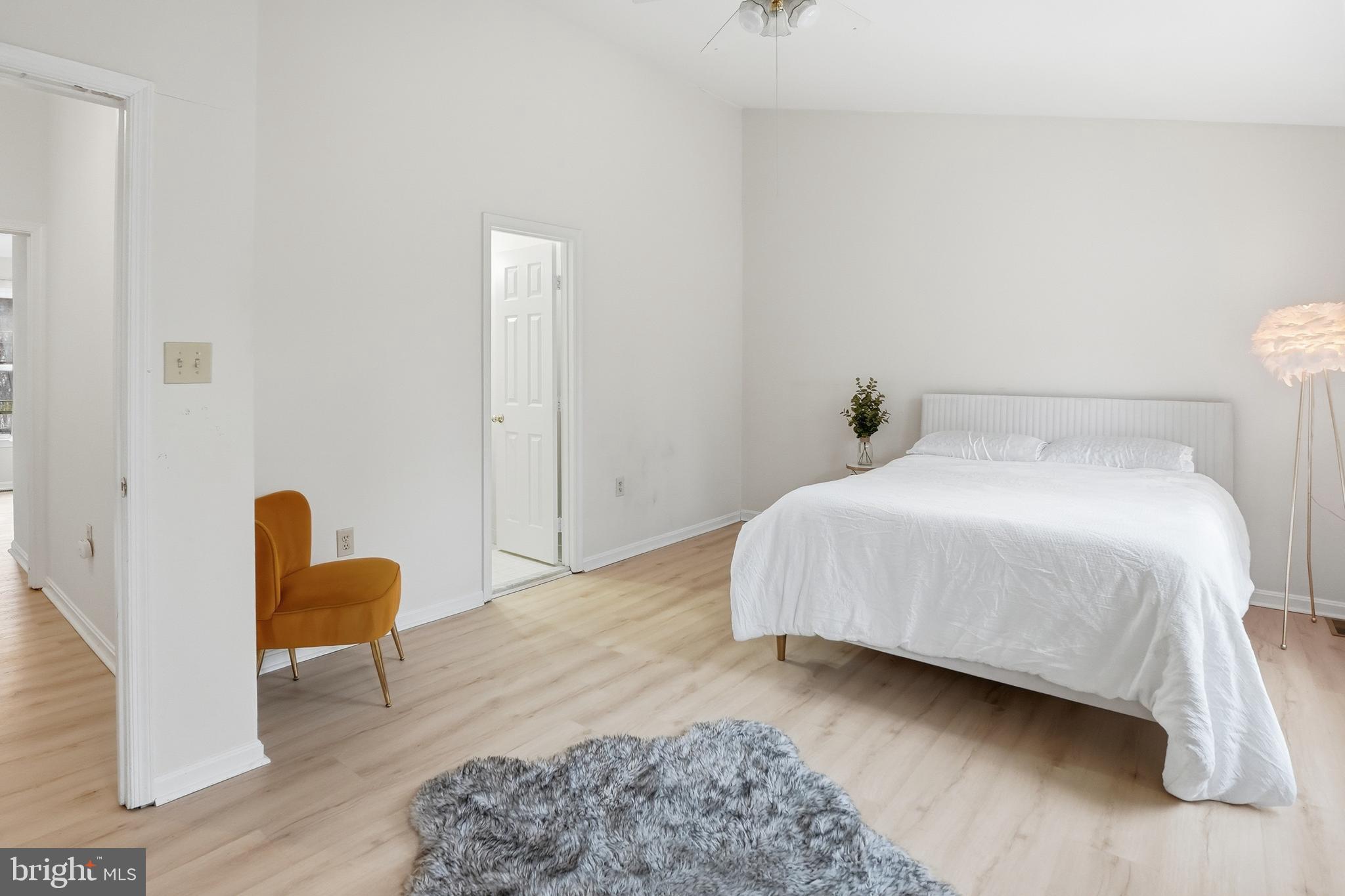 6524 Milva Lane Springfield, VA 22150 - Photo 31 of 47 a bedroom with a bed and chair