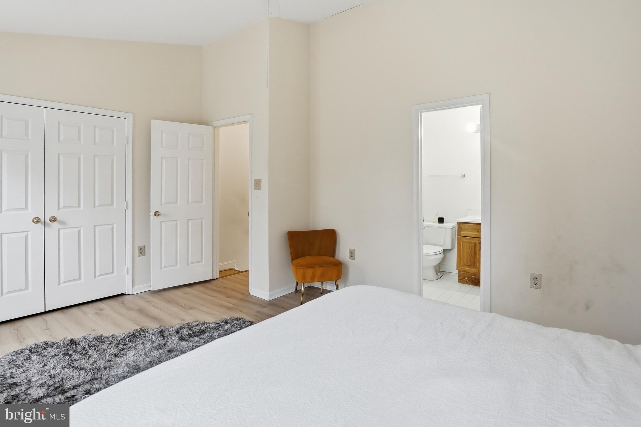 6524 Milva Lane Springfield, VA 22150 - Photo 32 of 47 a bedroom with a bed and wooden floor