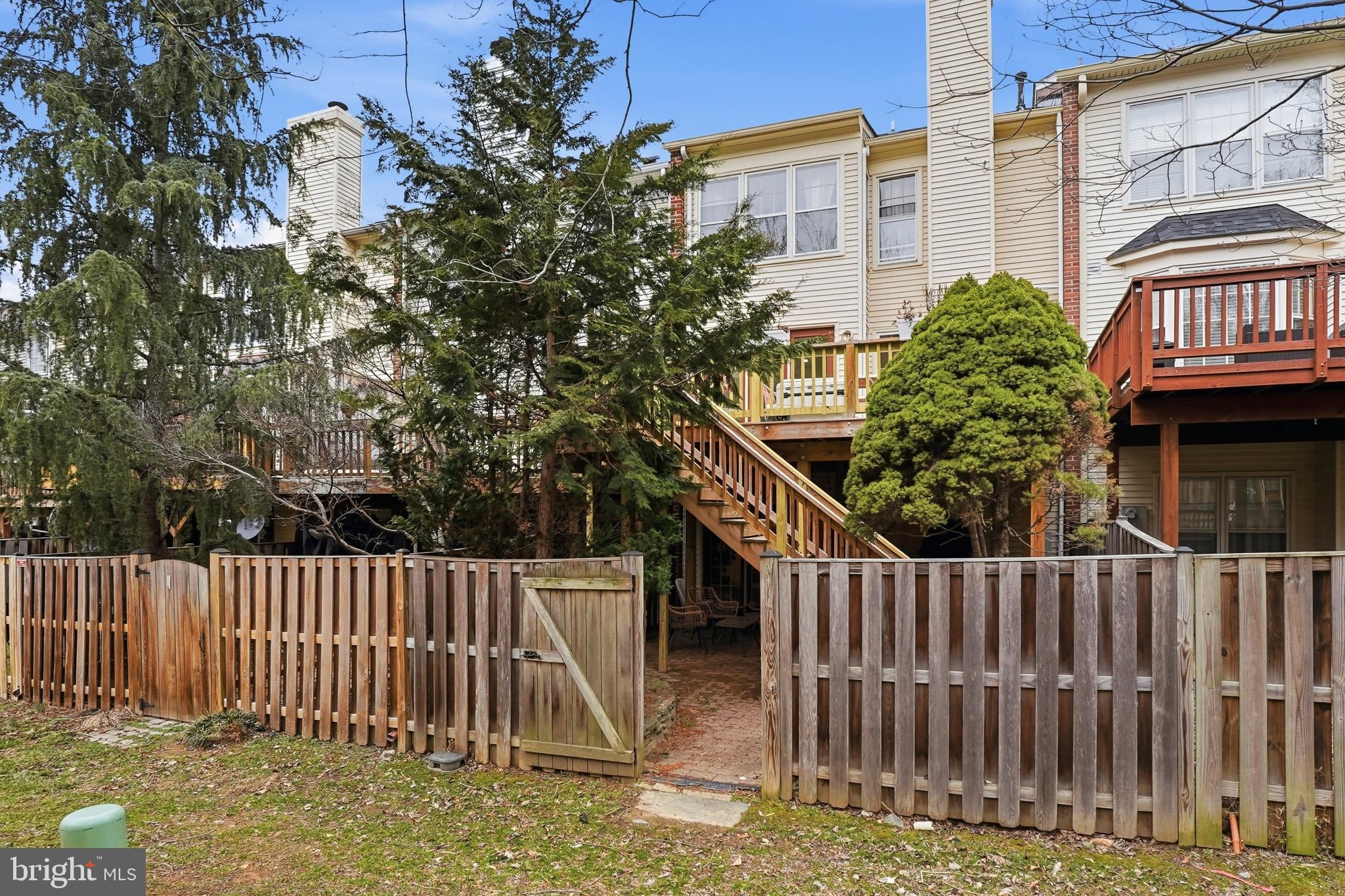 6524 Milva Lane Springfield, VA 22150 - Photo 42 of 47 a view of a brick house with wooden fence and floor