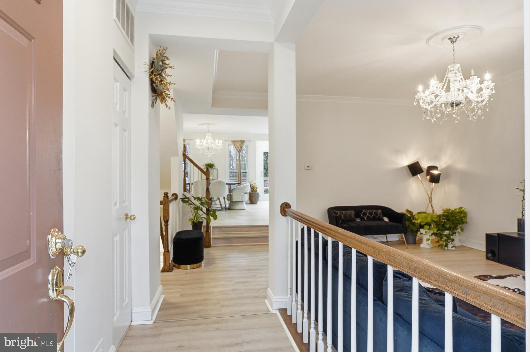 6524 Milva Lane Springfield, VA 22150 - Photo 6 of 47 a view of a hallway to a livingroom and a dinning area a chandelier