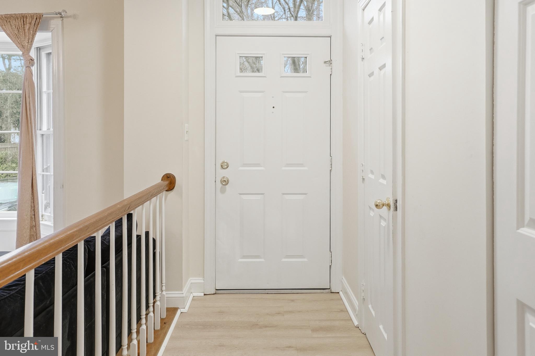 6524 Milva Lane Springfield, VA 22150 - Photo 8 of 47 a view of a hallway with wooden floor