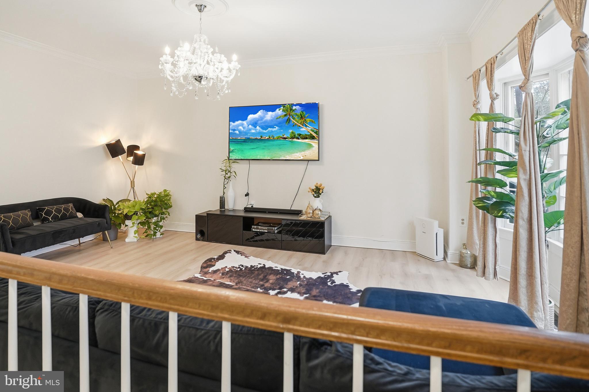 6524 Milva Lane Springfield, VA 22150 - Photo 10 of 47 a living room with furniture and a chandelier