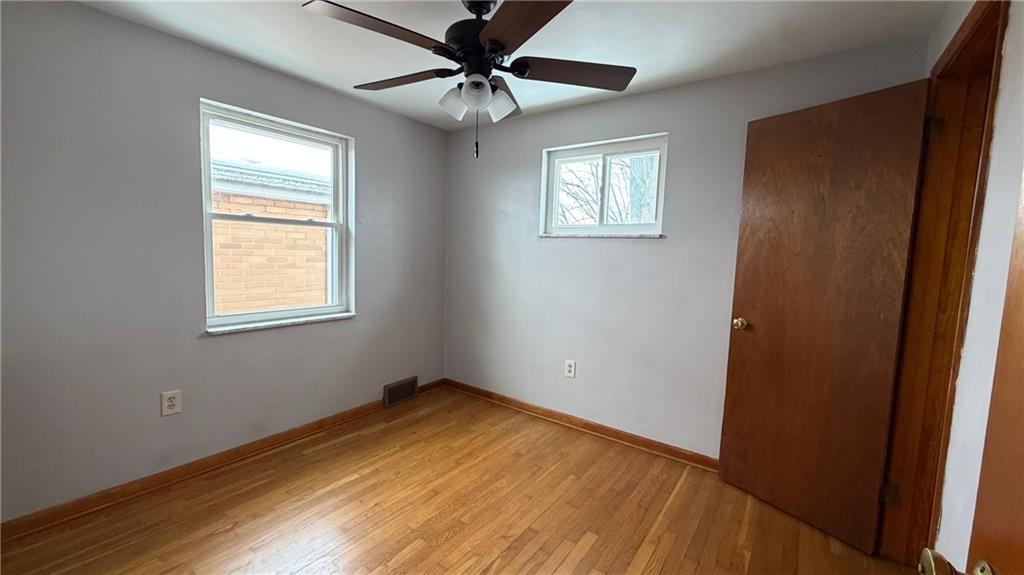 22 Adrian Avenue, Unit 2 Pittsburgh, PA 15229 - Photo 11 of 14 a view of empty room with wooden floor and fan