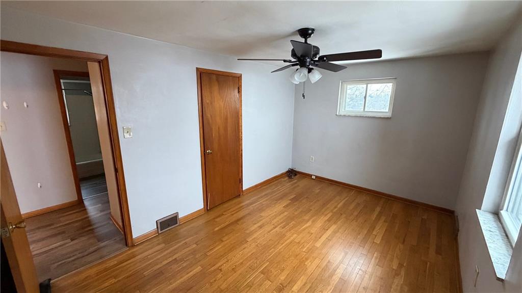 22 Adrian Avenue, Unit 2 Pittsburgh, PA 15229 - Photo 7 of 14 a view of empty room with wooden floor and fan