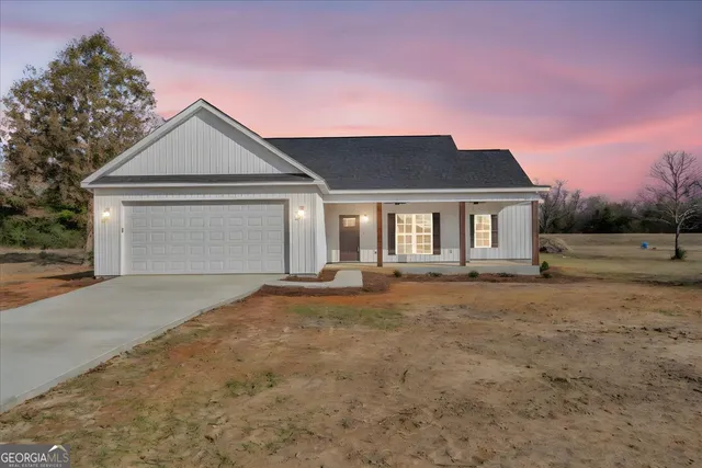 a living room with furniture a flat screen tv and a dining table with wooden floor