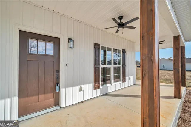 a view of kitchen with cabinets appliances and wooden floor