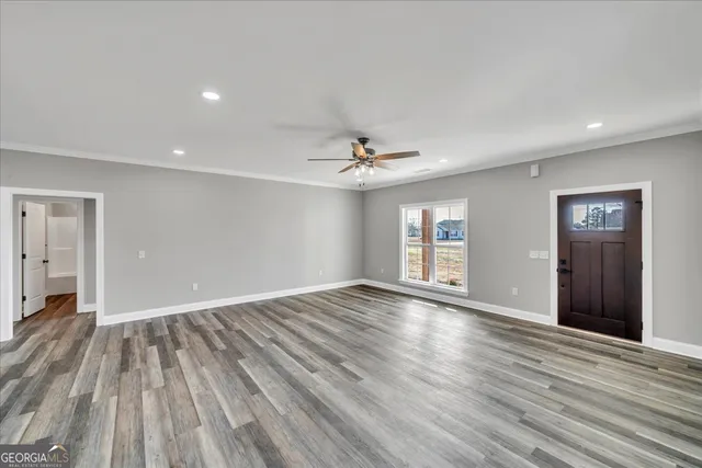 a large kitchen with kitchen island a sink stainless steel appliances and cabinets