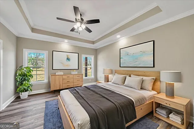 a en suite bathroom with a granite countertop sink and a mirror