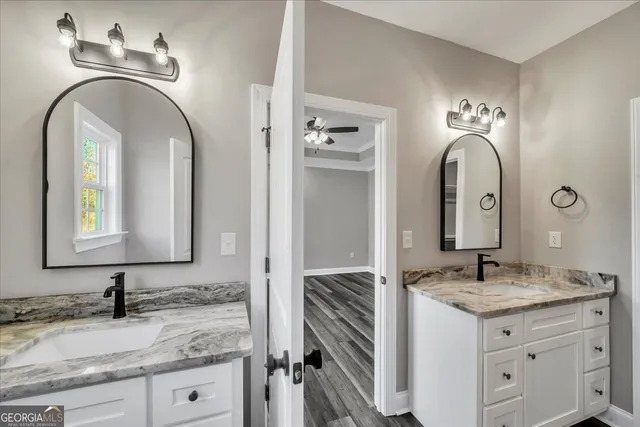 a view of a room with wooden floor