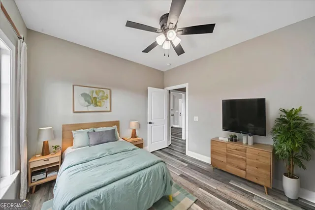 a view of a hallway with wooden floor and a fireplace