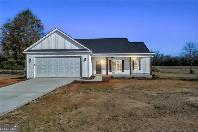 an empty room with windows and outdoor view