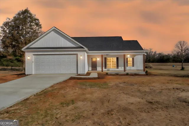 a view of an empty room with a ceiling fan and wooden floor