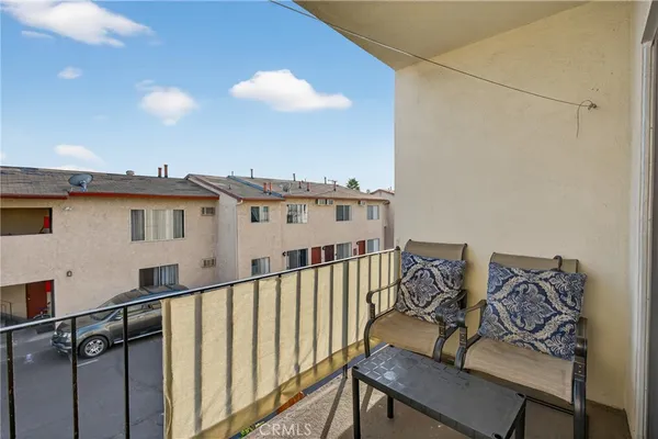 a view of a balcony with furniture