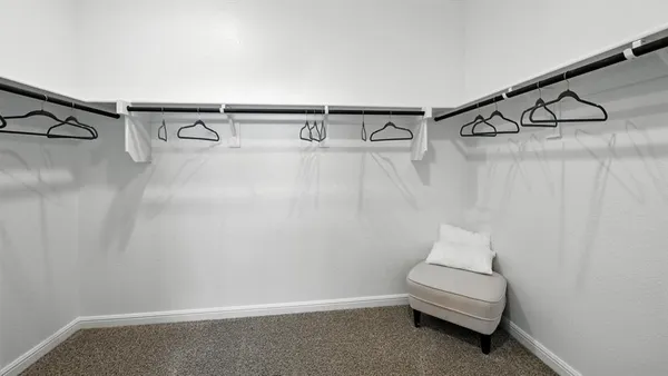 a spacious bathroom with a double vanity sink and mirror