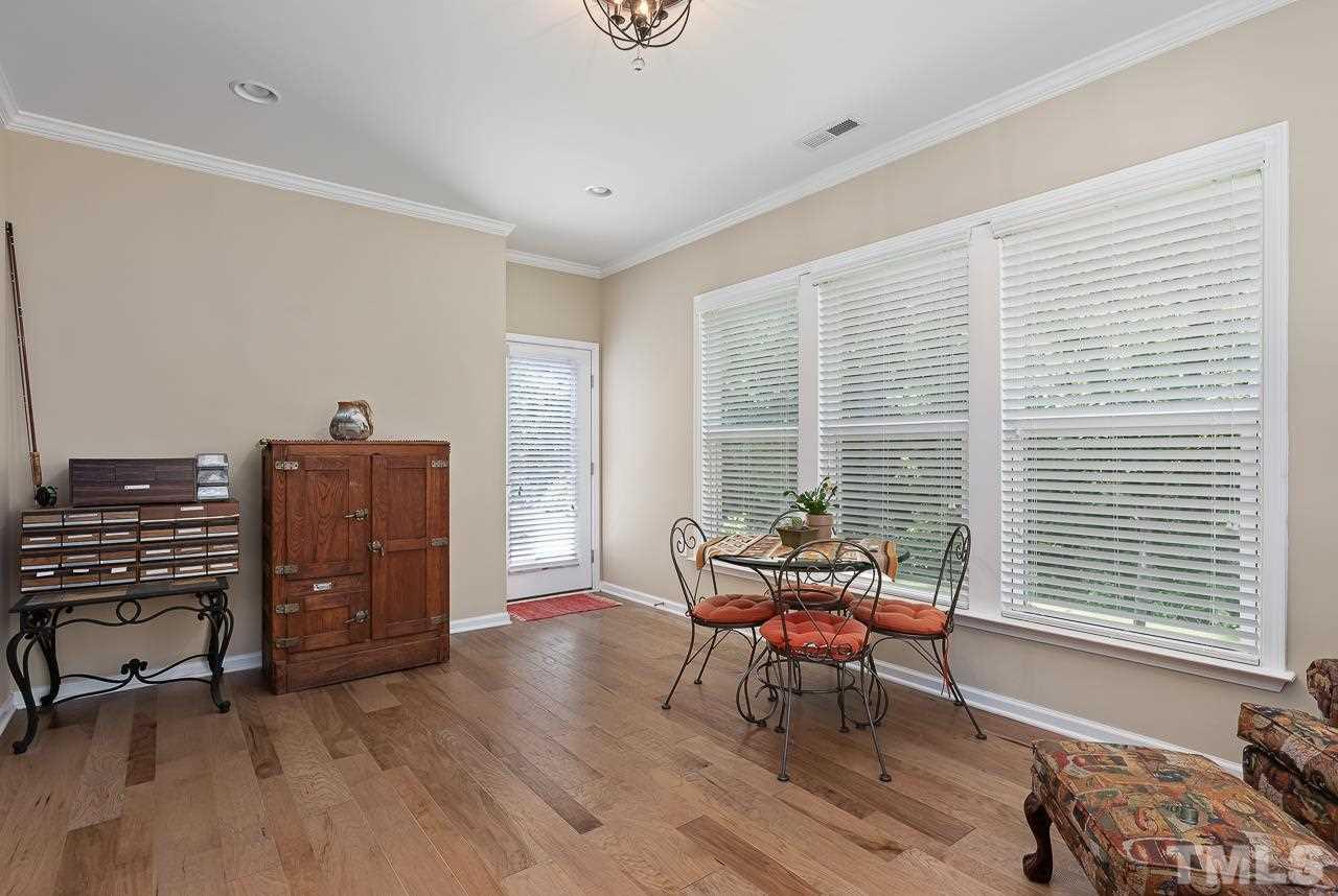 613 Tuttle Road Durham, NC 27703 - Photo 12 of 30 Sunroom overlooks quiet, shady backyard adjacent to a protected area. Large trees provide plenty of shade on sunny afternoons!
