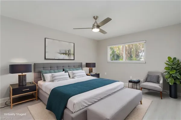 a bedroom with bed and a couch