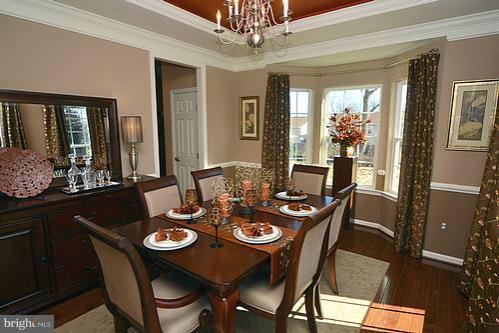 7332 Windsor Mill Road Baltimore, MD 21244 - Photo 1 of 19 a view of a dining room with furniture window and outside view