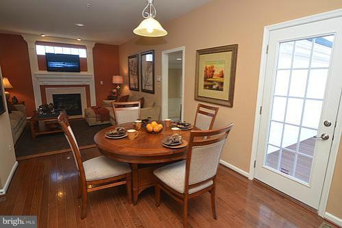 7332 Windsor Mill Road Baltimore, MD 21244 - Photo 11 of 19 a view of a dining room with furniture window and wooden floor