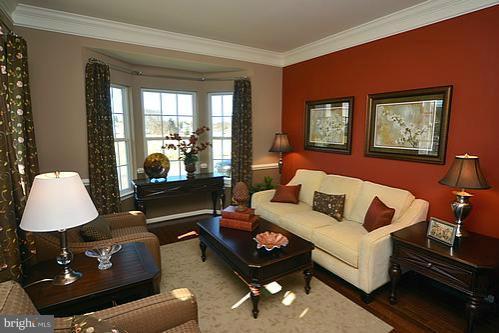 7332 Windsor Mill Road Baltimore, MD 21244 - Photo 15 of 19 a living room with furniture and a window