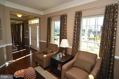 7332 Windsor Mill Road Baltimore, MD 21244 - Photo 16 of 19 a living room with furniture and large windows
