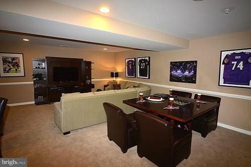 7332 Windsor Mill Road Baltimore, MD 21244 - Photo 18 of 19 a living room with furniture and a flat screen tv